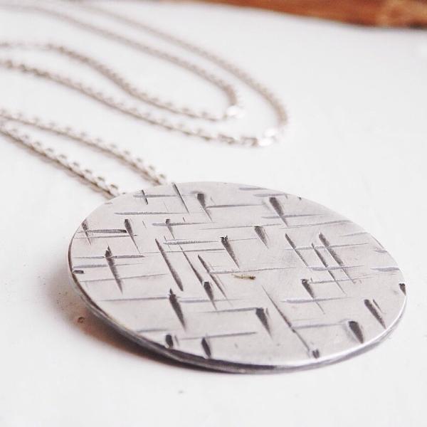 silver round long pendant with hammer marked pattern, contemporary irish jewellery for tomboys